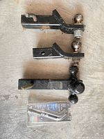 three ball mounts, Reese pin lock package visible