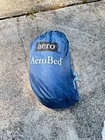 Blue nylon storage bag with AeroBed branding