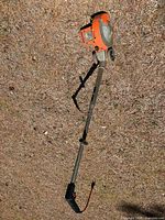 Full view of Black & Decker 8200 Deluxe lawn edger lying on ground