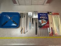 All items laid out with measuring tape for scale