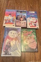 Front view of all five VHS tapes displaying titles and cover art