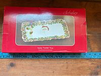 Box top showing tray image and dimensions reference tape