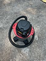 Top view of assembled Husky shop vacuum showing hose and motor lid