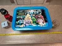 Top view showing all four items and tape measure for scale