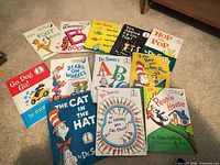 All 13 children’s books laid out on carpet