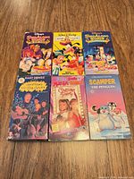 Front view of all six VHS tapes showing cover art