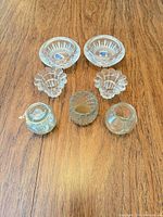 All seven crystal and glass pieces displayed