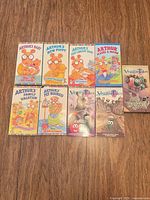 Front covers of all nine VHS tapes laid out