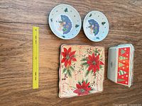 Overview of platter, two bowls, scale ruler visible