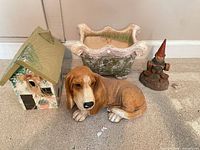 Group shot of all four items: planter, birdhouse, basset hound statue, gnome figurine