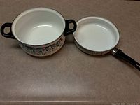 Pot and skillet side by side showing interiors and handles