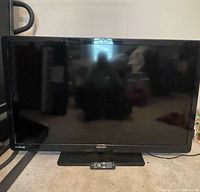 Front view of Philips LCD TV on stand