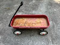 Full side view of Radio Flyer wagon showing handle and wheels