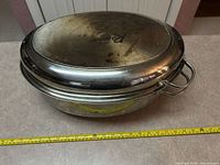 Top view of lid showing Rancher logo and staining