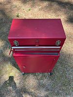 Top view of red rolling tool cabinet with detachable toolbox closed