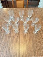All eleven etched floral stemware pieces grouped on table