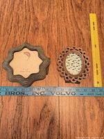 Front view of both frames with ruler and tape for scale