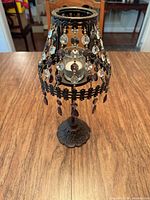 candle holder assembled with beaded shade
