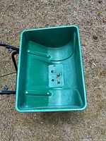 Top view of green plastic hopper interior