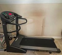 Full side view of Vision Fitness treadmill