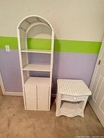 Tall arched wicker cabinet and nightstand side by side
