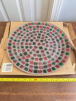 Front view of glass mosaic plate showing pattern and condition