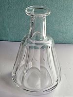 Full front view of clear ribbed glass decanter