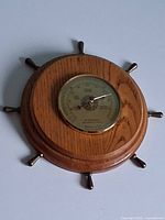 Front view of oak ship-wheel barometer