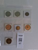 All seven medals in holders, front view