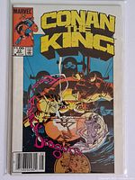 Front cover of Conan the King #22 in bag with board