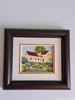 Front view showing entire framed painting and mat