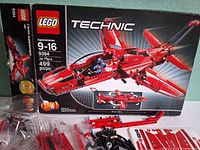 Front of LEGO Technic 9394 box with bagged pieces and sticker sheet visible