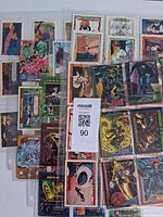 Mixed stacks of Marvel, Fortnite, anime and Disney cards in sleeves