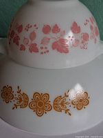 Both Pyrex bowls stacked showing pattern details