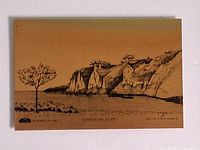 Full view of brass plaque showing entire etched landscape