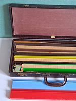 Open brown faux-leather case with racks and slats visible