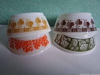 All four bowls stacked in two columns showing exterior patterns