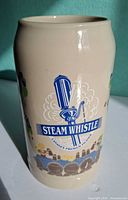 Front view showing Steam Whistle logo and overall colour