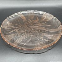 Top view showing full platter, floral design and iridescent pink glass