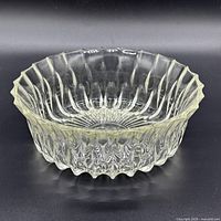 Front angled view of clear pressed glass ribbed bowl