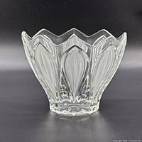 Front view showing pressed petal panels and scalloped rim