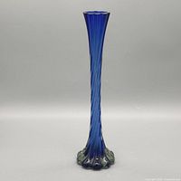 Full front view of cobalt blue twisted swirl bud vase