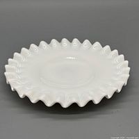 Top view showing ruffled rim and smooth interior surface