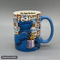 Front view showing Cookie Monster graphic and blue handle