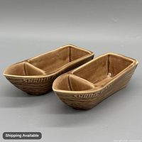 Pair of brown ceramic divided shrimp boat dishes top view