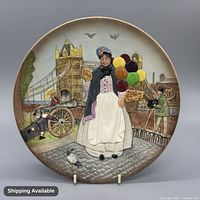 Front view of decorative plate with multicolor street scene