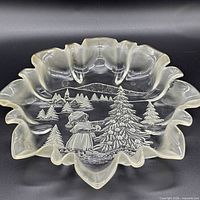 Top view of ruffled opalescent milk glass bowl showing winter scene