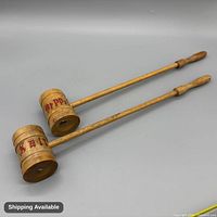 Two long-handled wood salt and pepper shakers with red lettering