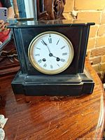 Front view showing enamel dial, bezel and overall case