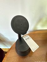 Front view of Belkin Auto-Tracking Stand Pro showing circular charging pad and base